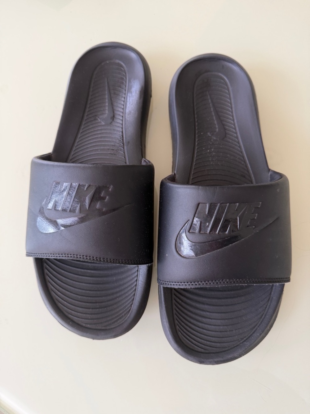 Nike Black Slide Sandals with Embossed Swoosh
